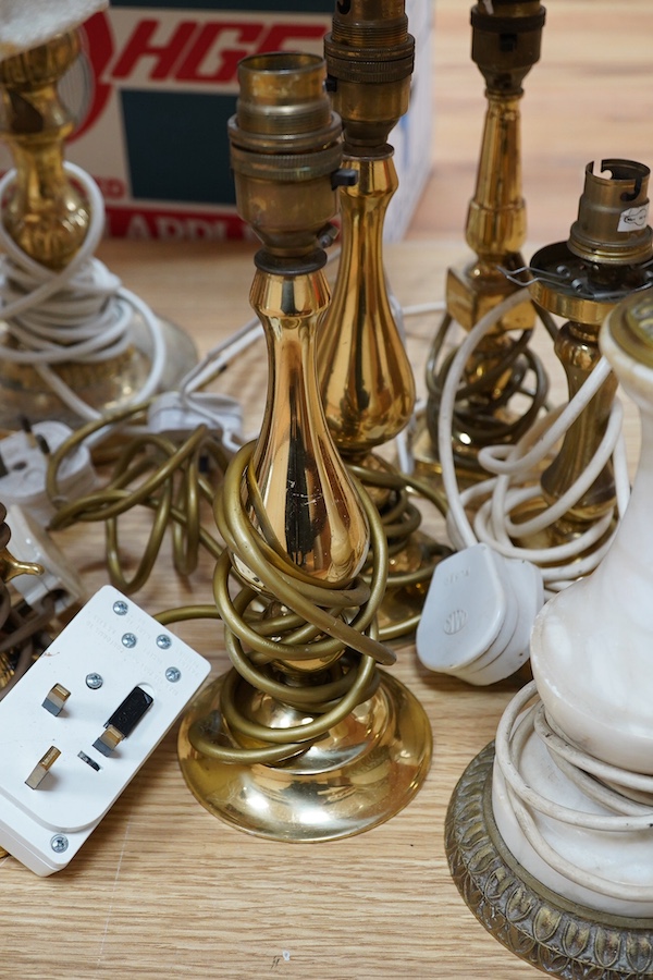 A figurative gilt metal table lamp, five brass table lamps and an alabaster lamp, tallest 35cm high. Condition - one poor, the others fair to good